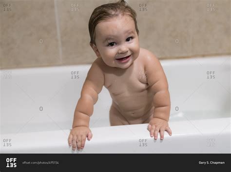 baby boy standing  bathtub stock photo offset