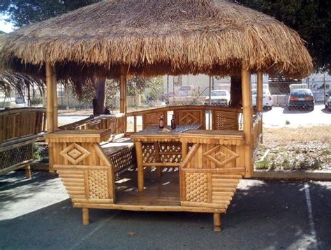 wooden gazebo  thatched roof   street