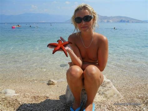 lovely blonde wife goes topless on vacation