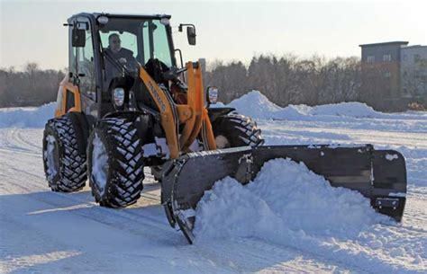 winter wheel loaders transform  machine  snow removal    prep