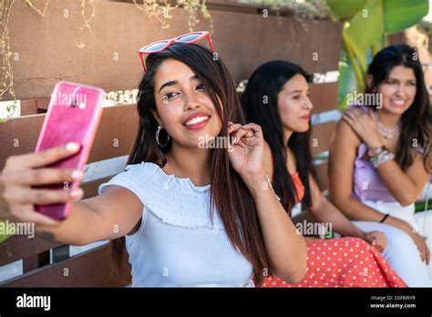Latin Woman Taking A Selfie With Her Friends Three Latina Girls Having