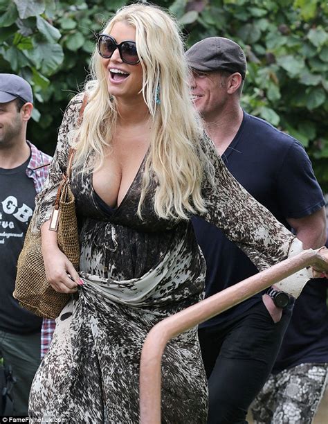 pregnant jessica simpson displays her curves in low cut