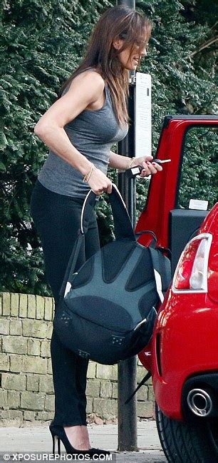 Melanie Sykes Packs Up New Red Car In Racy Skintight Jeans Daily Mail