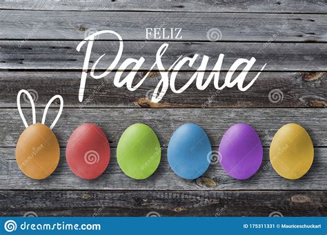 wooden background  colourful easter eggs  spanish words