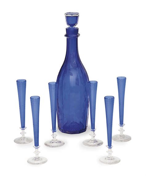 An English Etched Cobalt Blue Glass Decanter And Stopper And Six