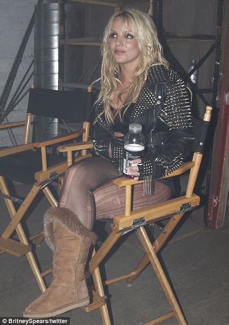 britney spears turns raunchy rock chick as she films new video till the