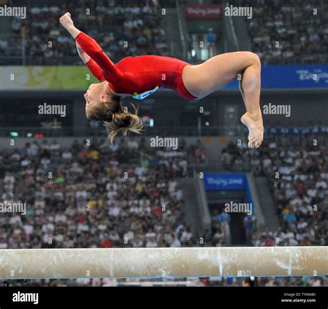 usa s star gymnast shawn johnson flips in the air during her routine on