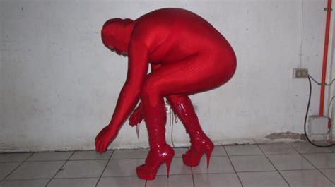 shiny red spandex lycra catsuit with red high heels boots fetish porn pic