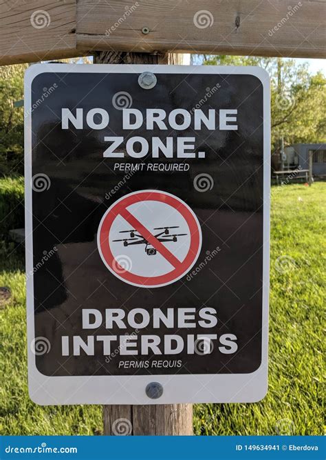 official bilingual  drone zone sign warning  crossed drone icon stock image image