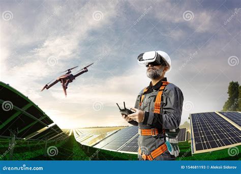 happy engineer  drone  vr helmet  cheking solar station stock image image