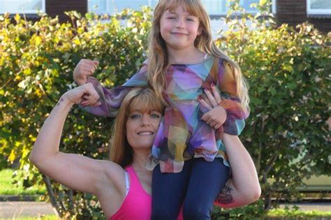 britain s strongest mom lifts cars and couch—with her daughter still sitting on it wow amazing