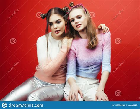 two best friends teenage girls together having fun posing