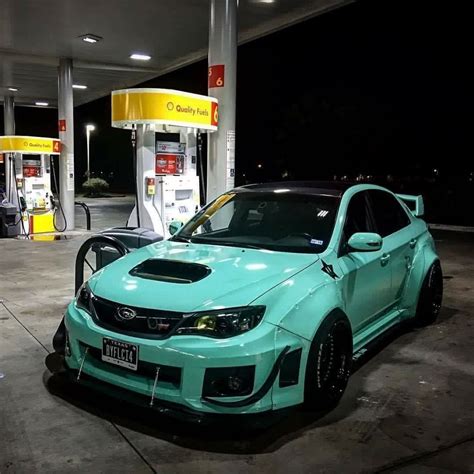 cars  parked  front  gas pumps  night   blue