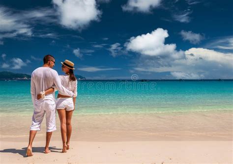 Couple In White Running On A Beach At Maldives Stock Image Image Of