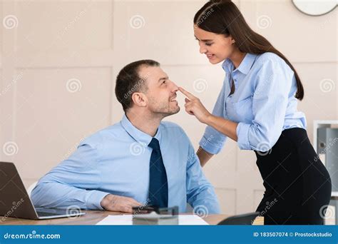 Businesswoman Seducing Male Employee Flirting At Workplace In Modern