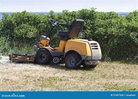 yellow lawn mower stock photo image  denmark green