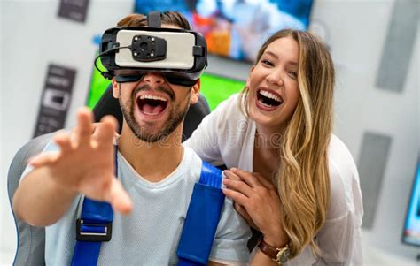 Couple Enjoying With Vr Goggles At Tech Store Shopping Virtual Reality