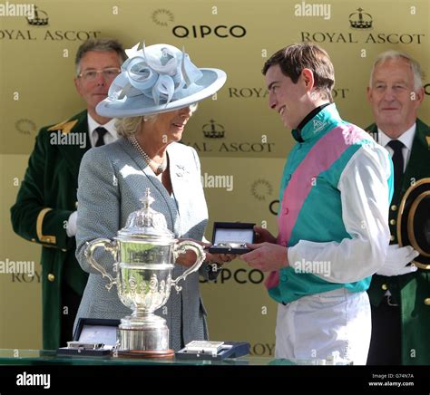 The Duchess Of Cornwall Presents Jockey James Doyle With A Trophy After