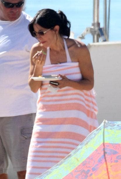 courteney cox in a white bikini on set of cougar town