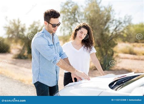 couple  road trip   directions  map stock photo image  navigation road