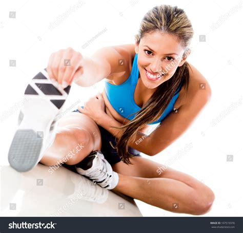 Fit Woman Stretching Her Leg To Warm Up Isolated Over White