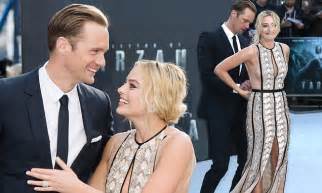 Alexander Skarsgard Helps Margot Robbie With Her Dress At Legend Of