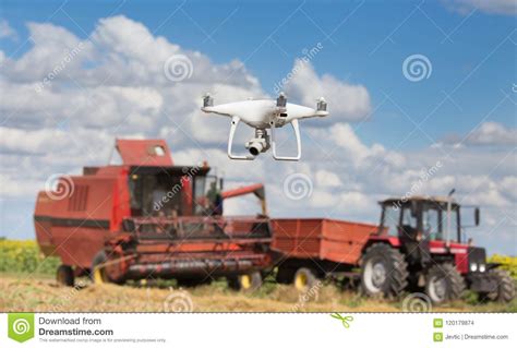 drone  front  tractor  combine harvester  field stock photo image  drone control