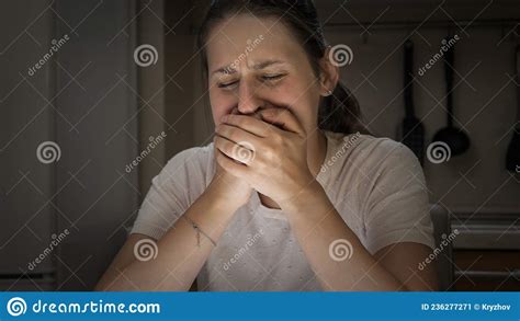 Portrait Of Stressed Crying Woman Holding Her Scream With Hands Stock