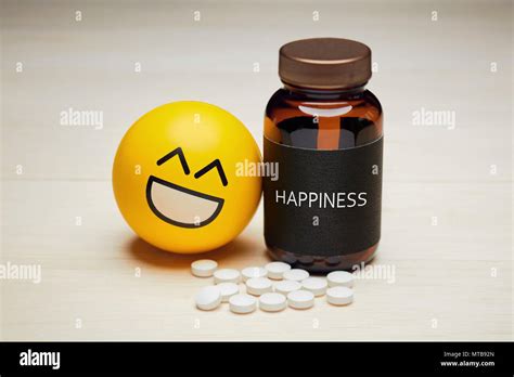 anti depressant drug   happiness concept yellow smiling emoji