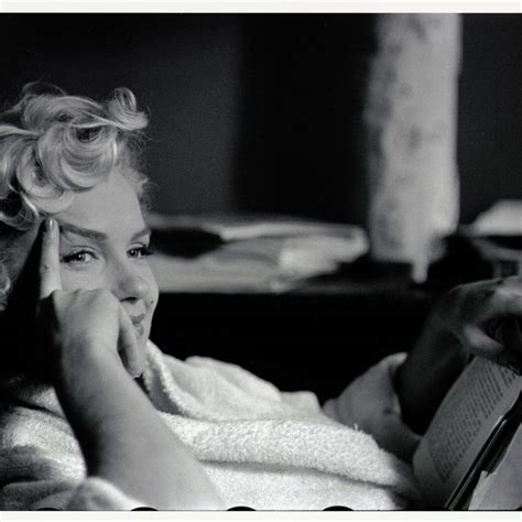 first look marilyn monroe in bed and sticking her tongue out in marilyn