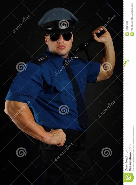 policeman with sunglasses in uniform poses stock image
