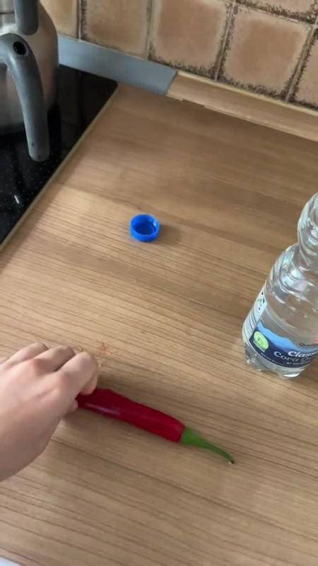 sister rubs hot chili on the top of brother s water bottle