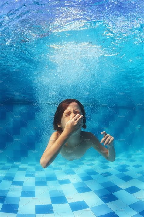 child jump  swim underwater high quality sports stock