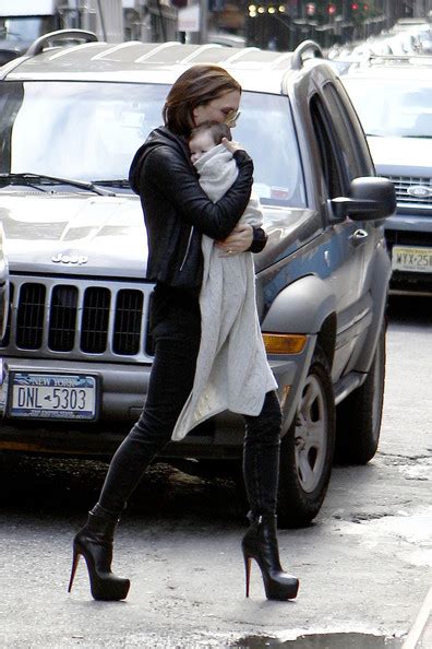 victoria beckham wears crazy louboutins while carrying