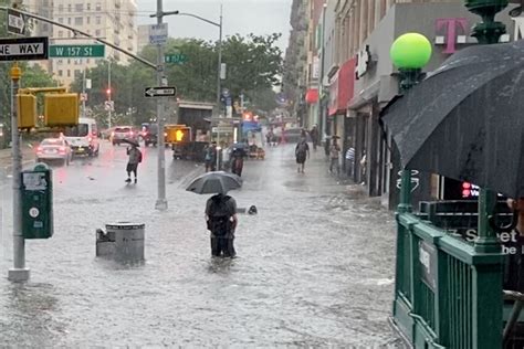 heavy rains pound new york city flooding subway stations and roads