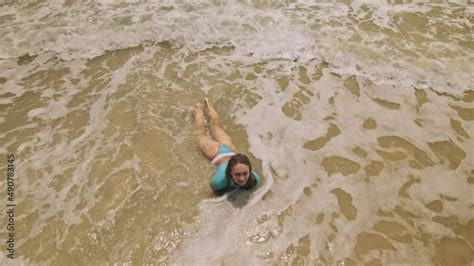 Crazy Madwoman Daring Funny Woman Lying On Shallow Water Sea Top View