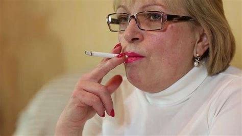 A Senior Woman Hand With Cigarette Female Smoker Close