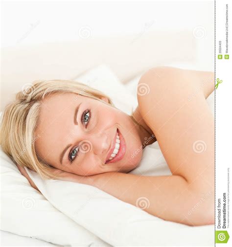 close up of a serene woman opening her eyes stock image image of lying indoors 20504403