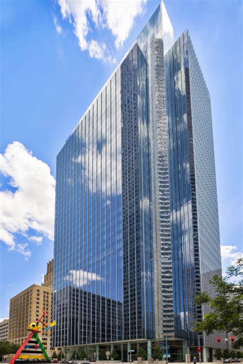 skanska sells  interest   bank  america tower office property
