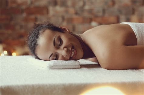 Free Photo African American Woman Receiving A Relaxing Massage At The Spa