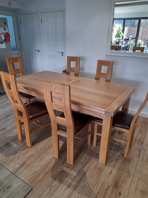 solid oak extending dining table   chairs set   potters