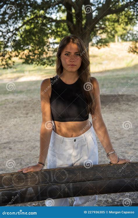 beautiful italian girl at the park wearing a dress stock image image