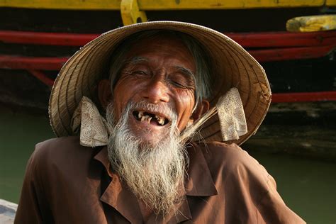 smiling vietnamese man hoi  vietnam   rights reserv flickr