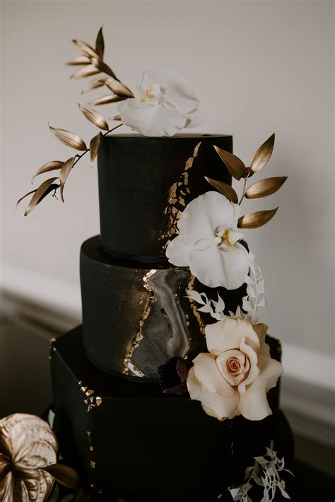 black marble wedding cake with gold leaf and fresh florals blush roses
