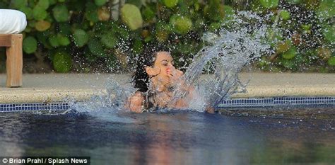 Kim Kardashian Cools Off In Daring See Through Bathing