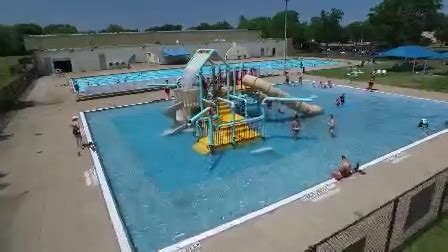 community pools  splash pads open today  people   cool