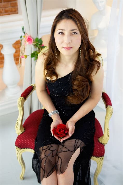 Japanese Woman Wearing Black Dress Sitting In Red And Gold