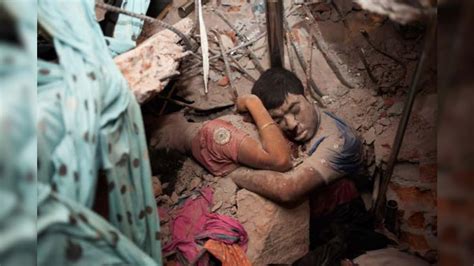 haunting photo of bangladesh couple in final embrace after building