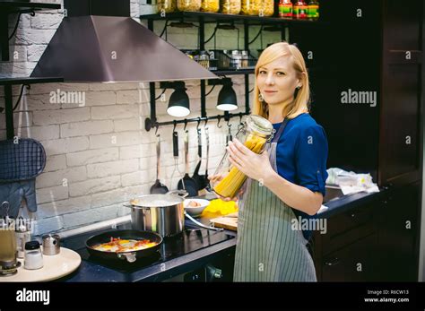 Woman Housewife Preparing In The Kitchen Smiling Young Blond Woman In