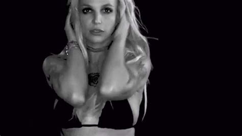 britney spears has very suggestive dance moves as she strips to tiny